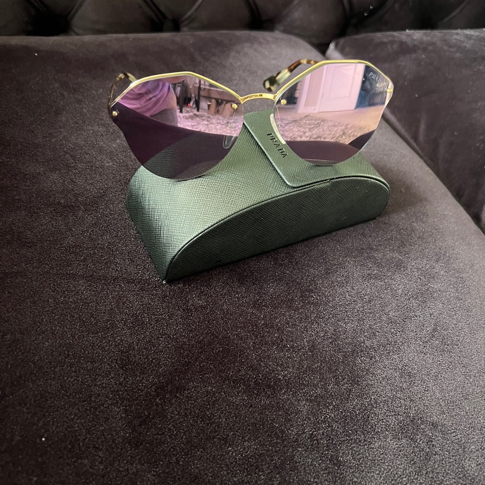 Prada women sunglasses.  Weared one time ONLY